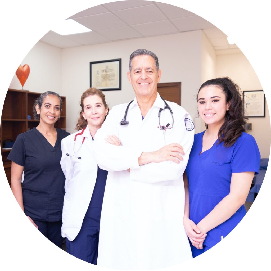 Two doctors and two nurses posing for a picture.