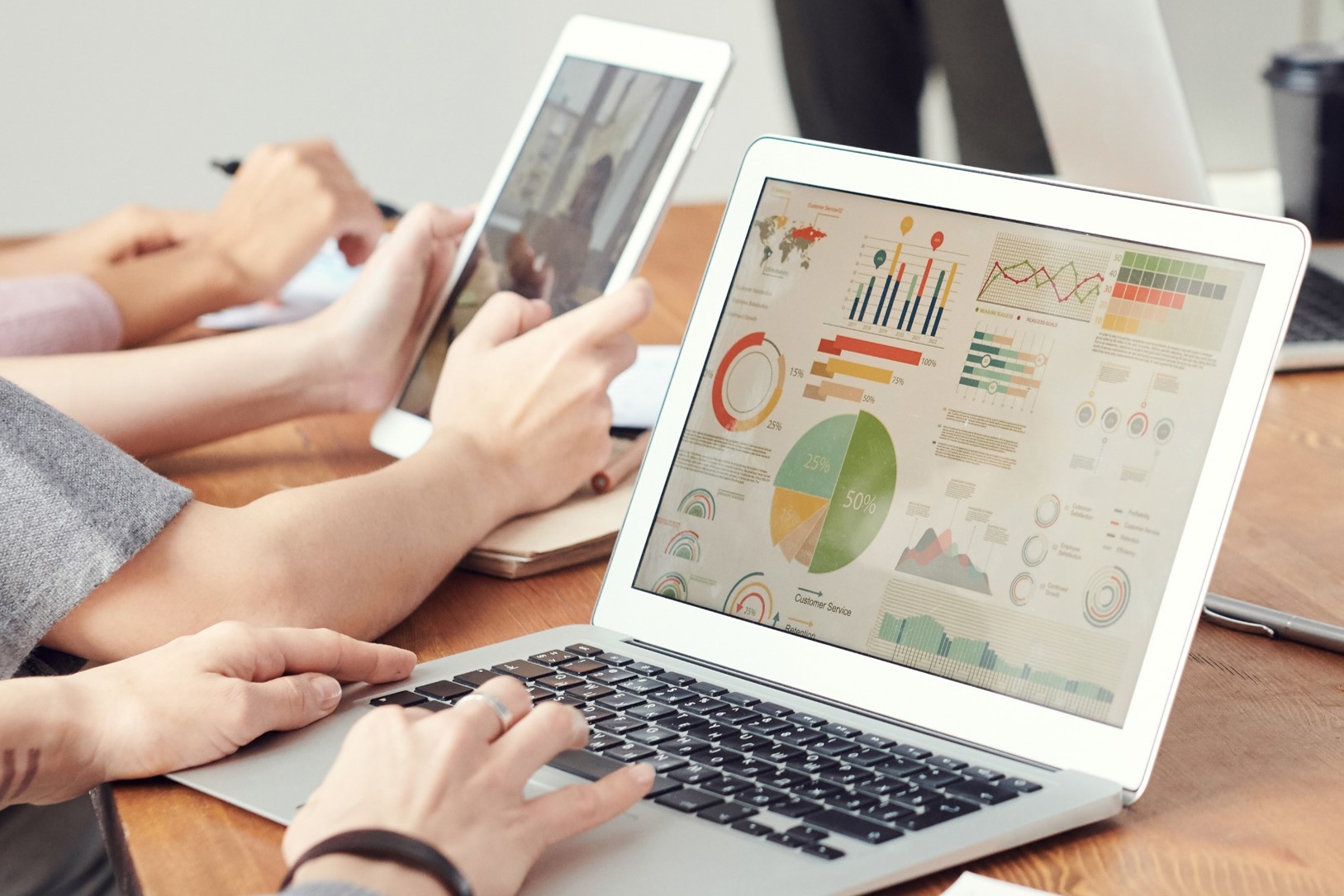 A laptop displaying various charts and graphs.